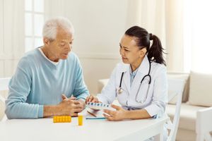 lady doctor with older patient